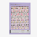 A sheet of colorful nail art stickers with various nature-themed designs. The sheet is purple and has the brand name "Deco Beauty" printed on it. There's a section titled "Wildflower" and instructions on how to apply the stickers. The stickers include designs like flowers, insects, mushrooms, and foxes.
