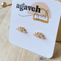 Gold leaf-shaped earrings on a 'agaveh girl' branded card.