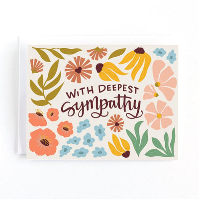 A sympathy card with a floral design. The card has a white background with colorful flowers, leaves, and the text 