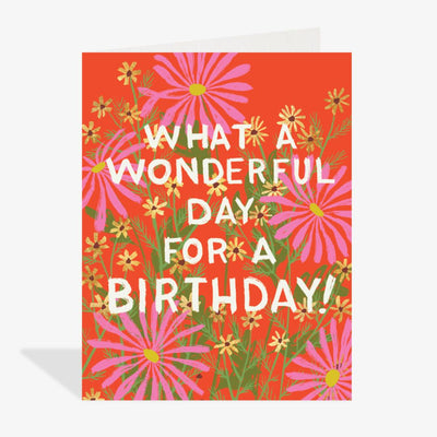 Birthday card with floral design and text on a red background