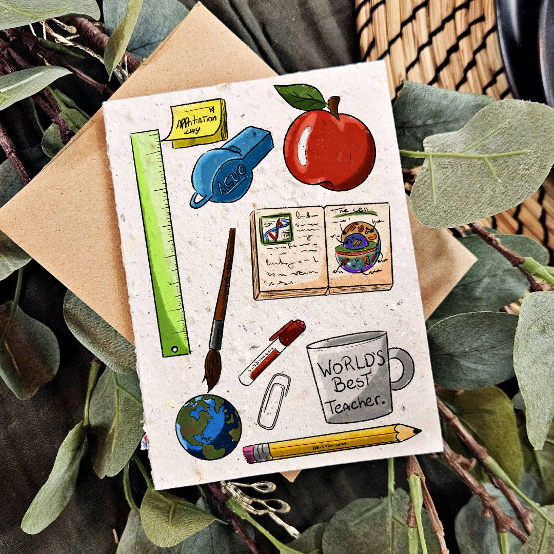 Illustrated card with school supplies and 'World's Best Teacher' mug on a leafy background