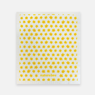 White towel with yellow floral pattern and 'naturebee' branding on a white background