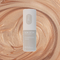Champagne Glow Stick: A bronze coloured highlighter stick makeup in a cardboard tube.