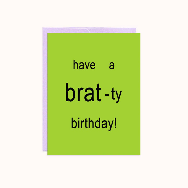 A bright green square card with a purple envelope. The card has the text 