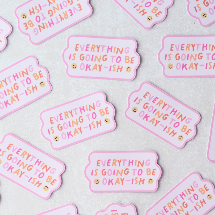 Everything Is Going To Be Okay-ish Sticker, a pink sticker with colourful words reading 
