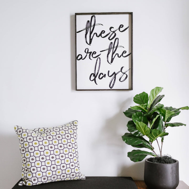 Framed wood sign with the text 