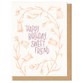 Greeting card with 'Happy Birthday, Sweet Friend' text and floral design on a white background.