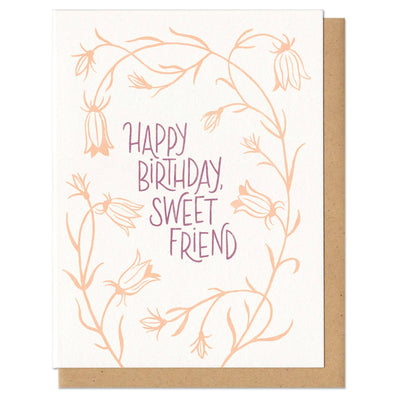 Greeting card with 'Happy Birthday, Sweet Friend' text and floral design on a white background.