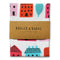 A white tea towel with a pattern of colorful houses and trees. The houses are in various sizes and colors, including pink, red, orange, yellow, blue, and green. The trees are green and have simple leaf shapes.