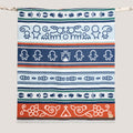 Decorative towel with tribal patterns on a white background