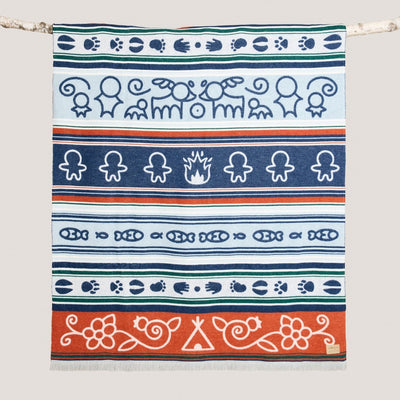 Decorative towel with tribal patterns on a white background