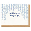 Card with blue tree illustrations and text 'our Hearts are Heavy for You' on a white background