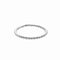 A delicate silver ring with a row of small beads.