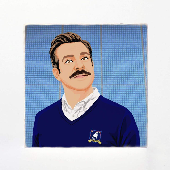 A ceramic coaster with Ted Lasso on it.