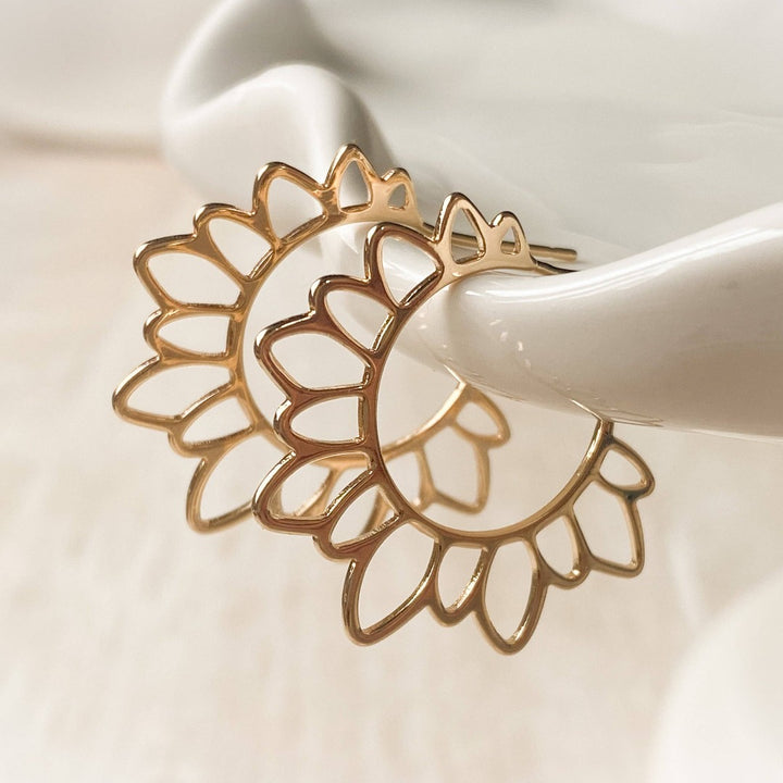 The Gold Flower Girl Hoops are so unique and fun for a hoop!  These are 14K gold plated floral hoops with a stainless steel post that is nickel free and safe for sensitive ears. Virtually weightless!  Made in Canada. Close up image