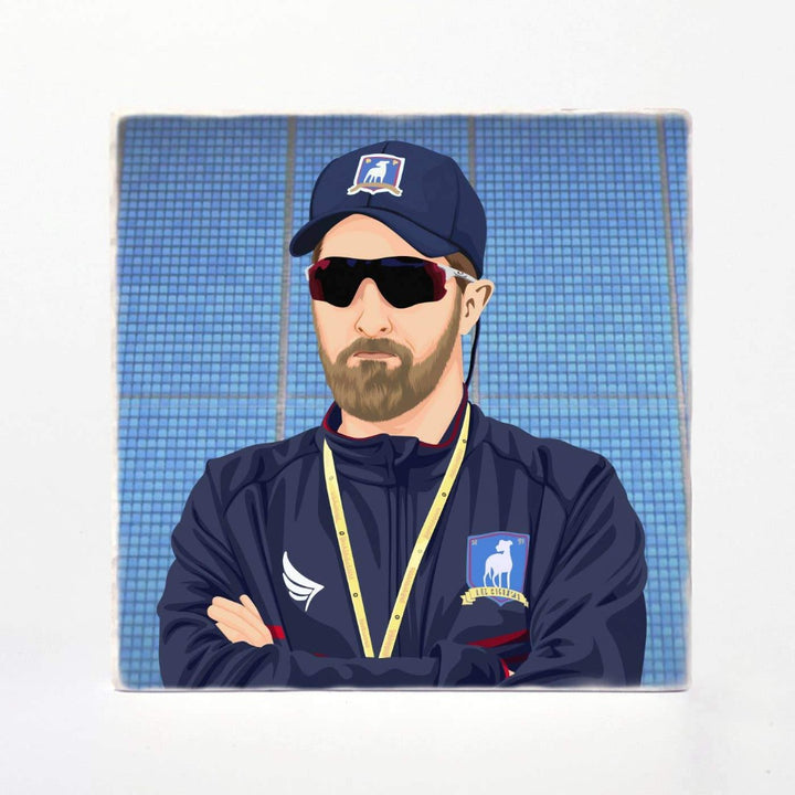 A ceramic coaster with Coach Beard from Ted Lasso on it.