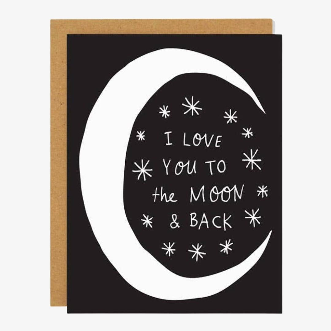 A black card with white moon and stars and quote "I love you to the moon & back".