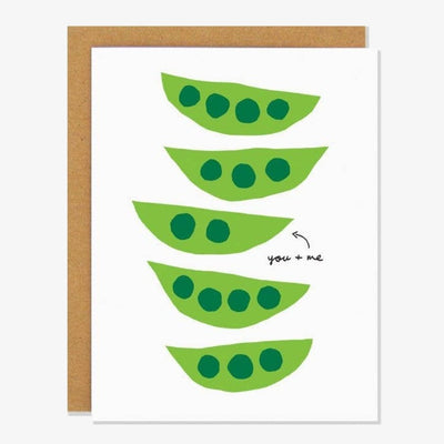 A white card with peas in pods and quote 
