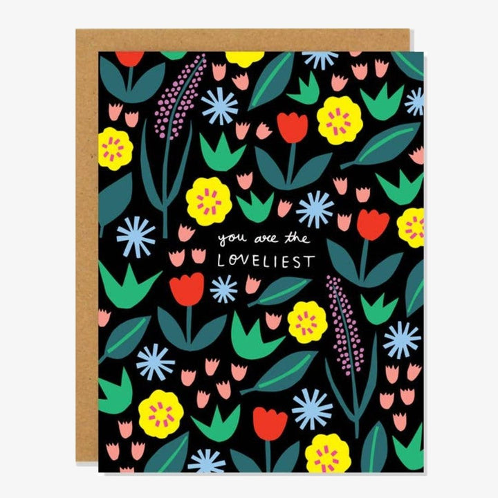 A black card with colourful flowers and quote 