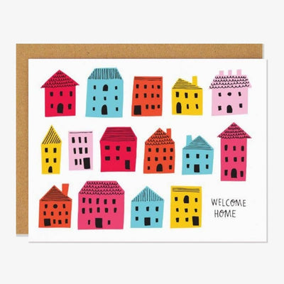 A white card with colourful houses and Welcome Home.