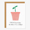 A white card with a little green plant in pink pot and quote 