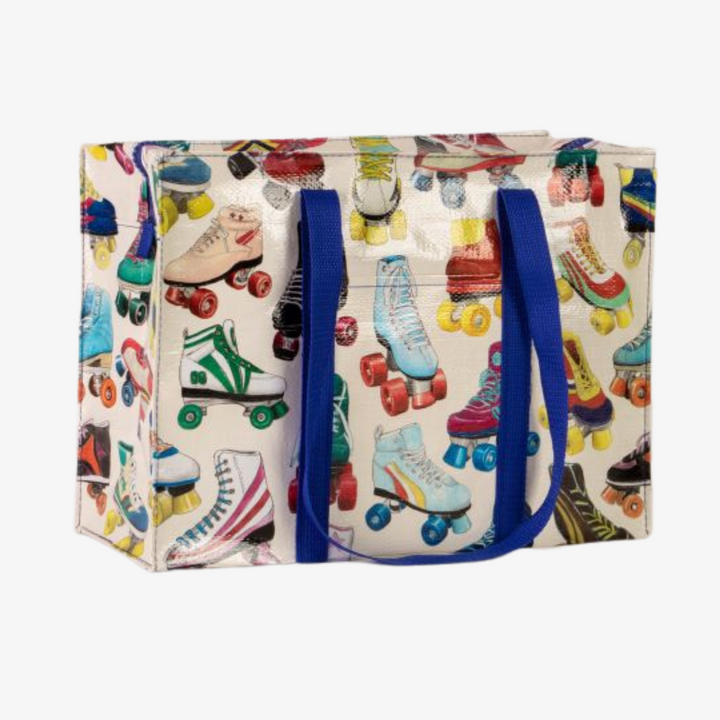 A large tote bag with a playful roller skate pattern. The bag is white with a variety of colorful roller skates printed all over it. The skates are in different styles and colors, and some have laces while others have buckles. The bag has blue handles.