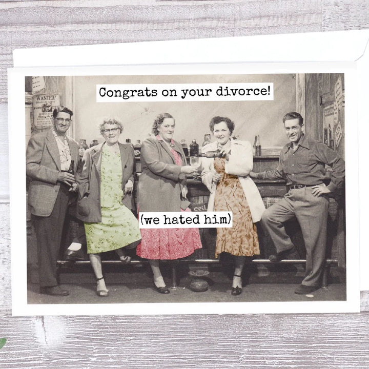 a vintage picture with two men and three women at a bar and the women's dresses are the only coloured part of the picture and the card says congrats on your divorce (we hated him)