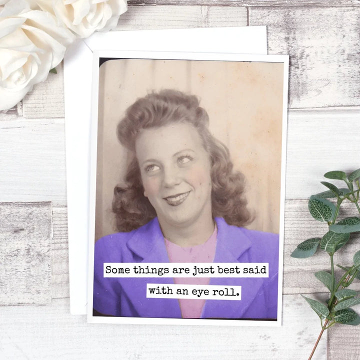 a vintage photo with a woman smiling and she's wearing a purple coat and pink shirt and the rest of the photo is black and white and the card says some things are just best said with an eye roll