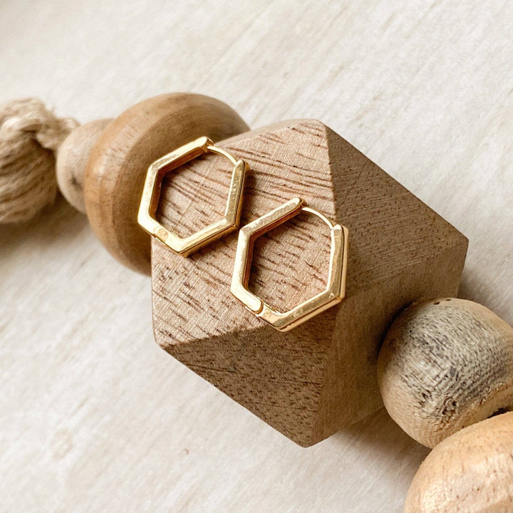 The Gold Hexi Huggies close up image Made from brass- plated with 18k gold. Nickel free and safe for sensitive ears.