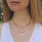 Woman wearing a gold rectangle chain necklace