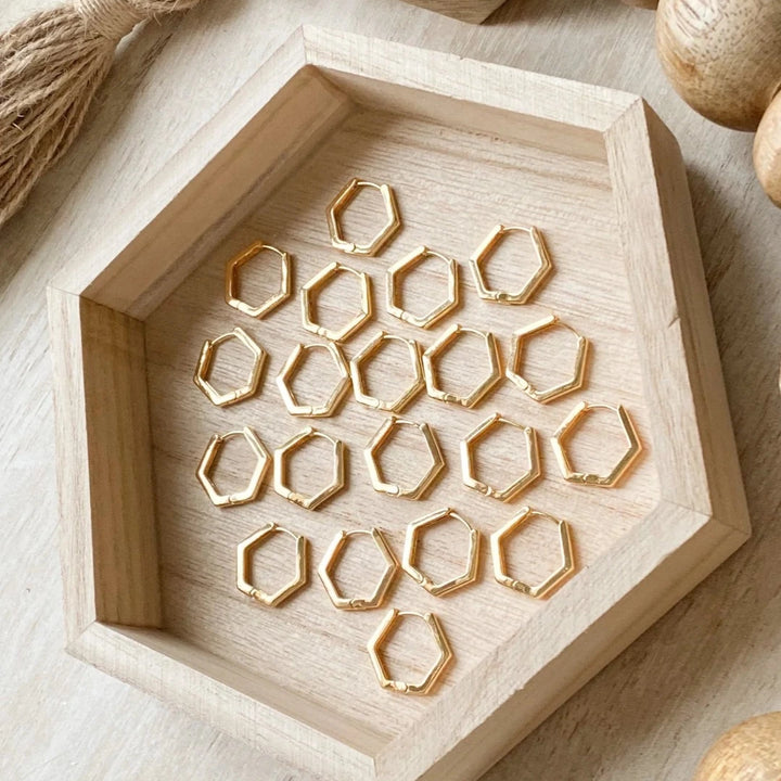 The Gold Hexi Huggies close up image Made from brass- plated with 18k gold. Nickel free and safe for sensitive ears.