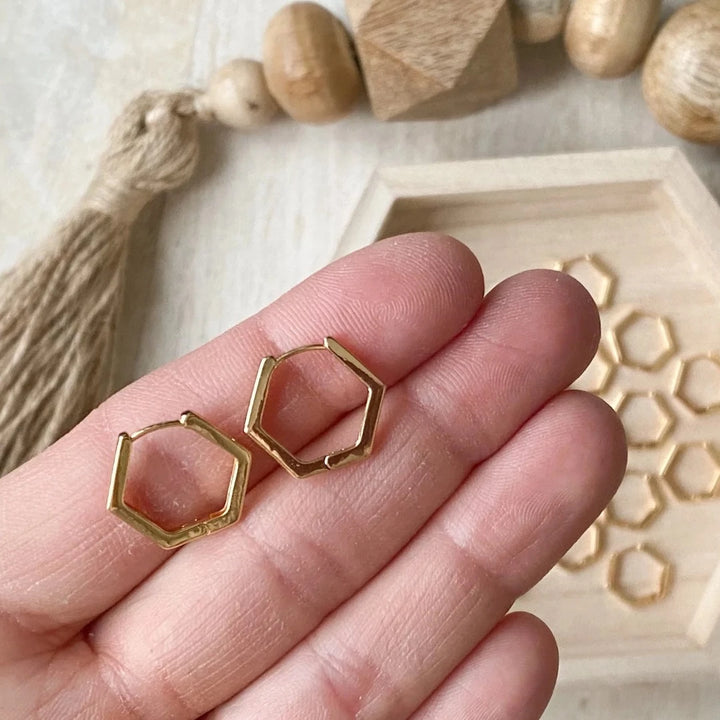 The Gold Hexi Huggies close up image Made from brass- plated with 18k gold. Nickel free and safe for sensitive ears.