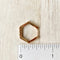 The Gold Hexi Huggies close up image Made from brass- plated with 18k gold. Nickel free and safe for sensitive ears. Measures about a half inch.