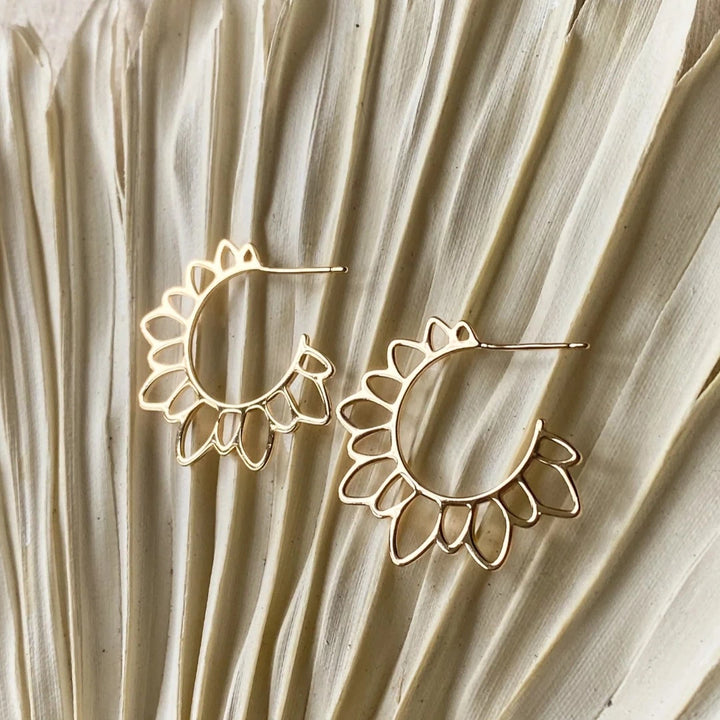 The Gold Flower Girl Hoops are so unique and fun for a hoop!  These are 14K gold plated floral hoops with a stainless steel post that is nickel free and safe for sensitive ears. Virtually weightless!  Made in Canada