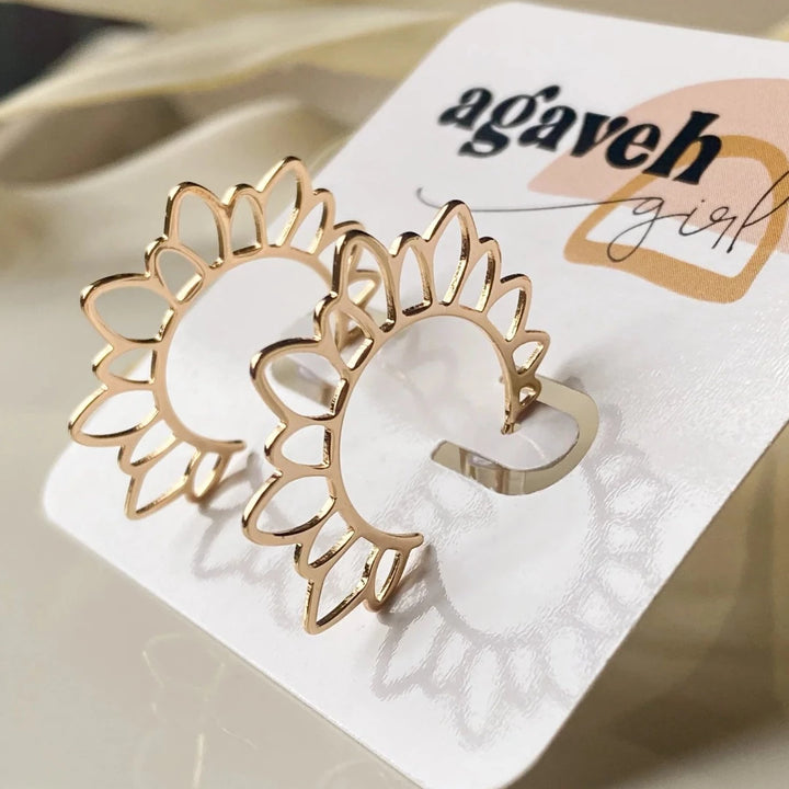 The Gold Flower Girl Hoops are so unique and fun for a hoop!  These are 14K gold plated floral hoops with a stainless steel post that is nickel free and safe for sensitive ears. Virtually weightless!  Made in Canada