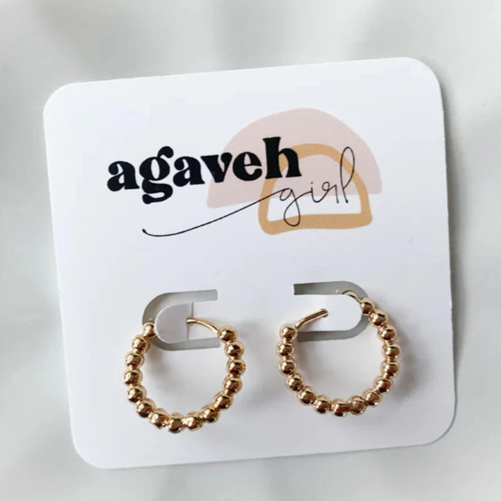 Gold Beaded Hoops. Gold hoop earrings made from gold beads connected into a circle.