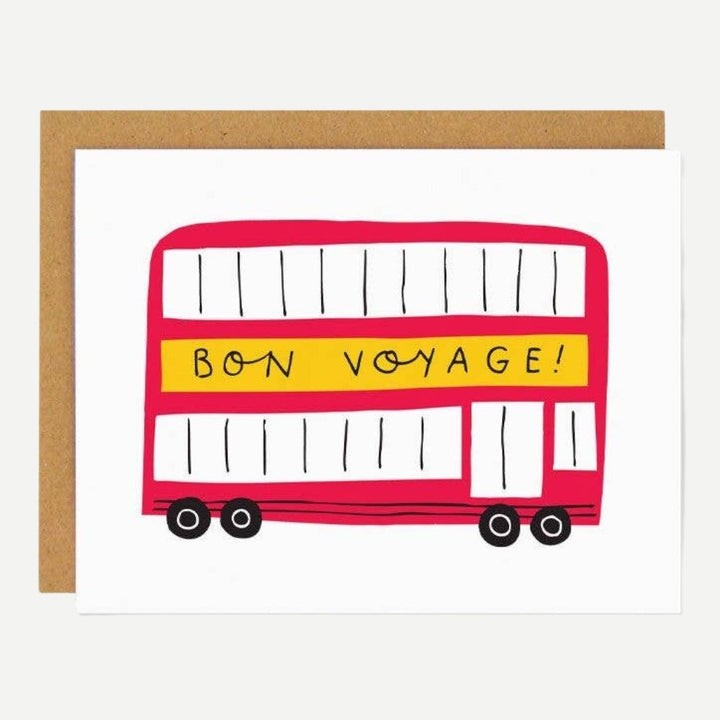 A white card with a red double decker bus and a yellow Bon Voyage banner written on the side.