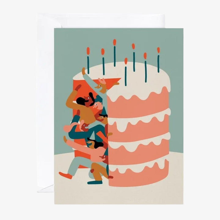 a blue card with a giant sized birthday cake that has a bunch of people coming out of it