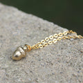 Close Up of Tiny Gold Acorn Necklace by Vintage Acorn